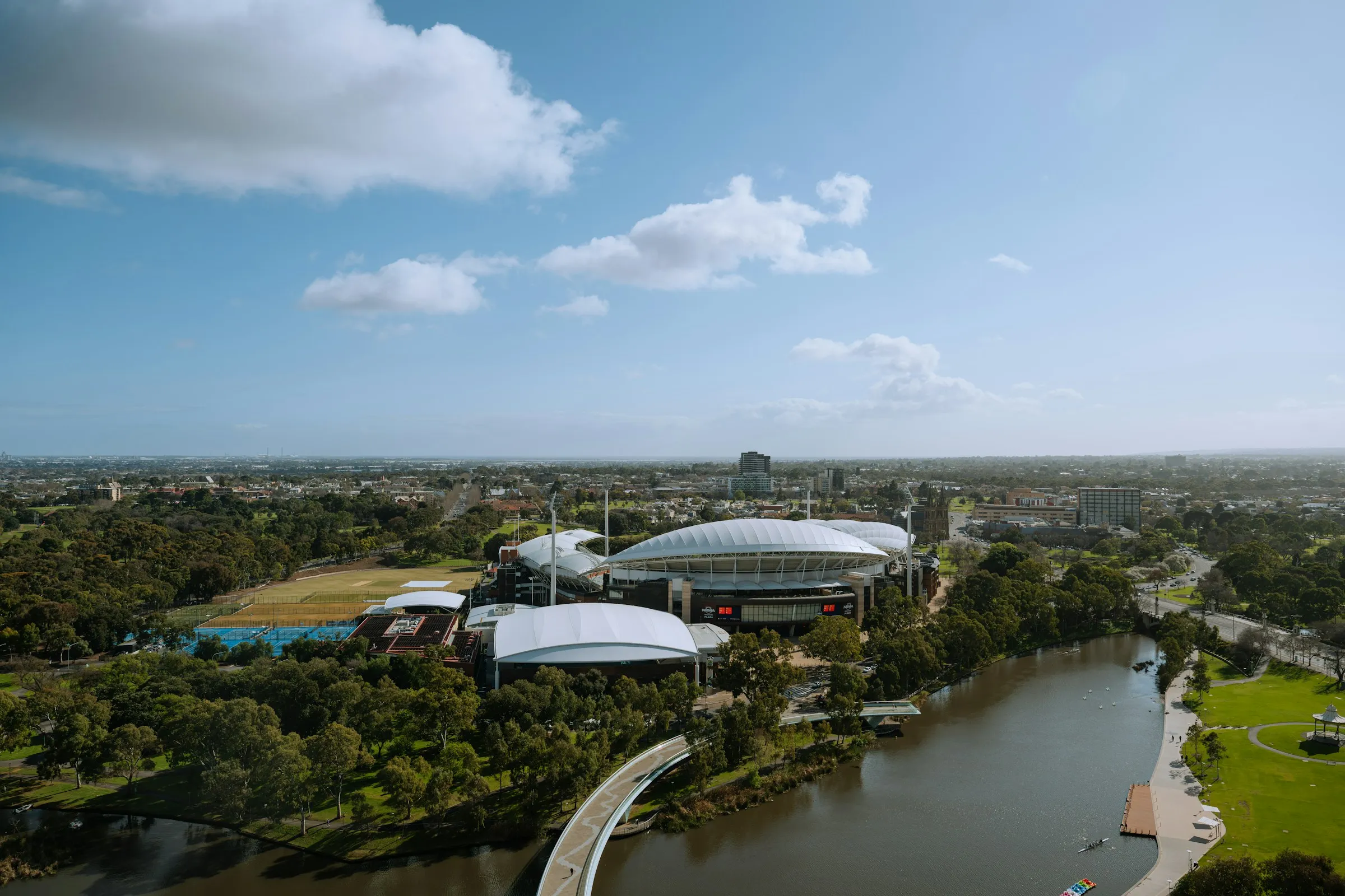 Adelaide Oval and the city beside the River Torrens on a sunny day